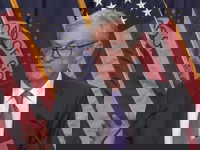 Deeply Divided Fed Lowers Rates by Quarter-Point