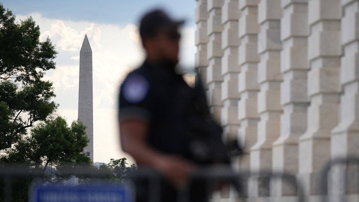 Man accused of threatening to kill member of Congress arrested steps from Senate building A Capitol Police officer stands guard outside the U.S. Capitol building with the Washington Monument in the background.