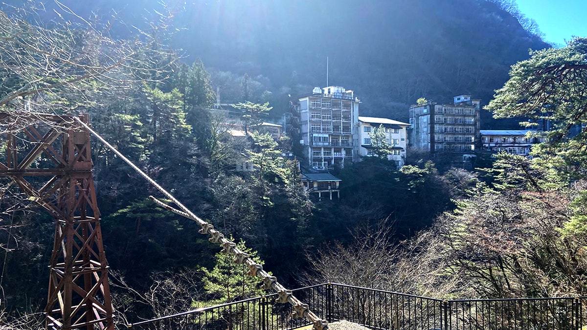 An explorer found a hauntingly preserved resort town in Japan, where towering hotels sit crumbling along a riverside cliff. It's reportedly been untouched for over three decades.