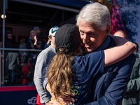 Bill Clinton spotted at NYC Marathon with bandaged nose while cheering on daughter Chelsea Bill Clinton and Chelsea Clinton hugging in NYC.