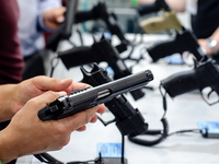 Handgun store shelves. A handgun for sale in the store.