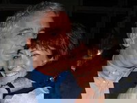 Jeffrey Epstein wraps his arm around Ghislaine Maxwell.