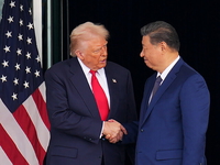 Ukraine Looms Big over Trump-Xi Meeting as Chinese Dictator Offers to Buy U.S. Oil U.S. President Donald Trump and Chinese President Xi Jinping shake hands as they depart fo