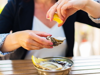 Woman eating raw oysters